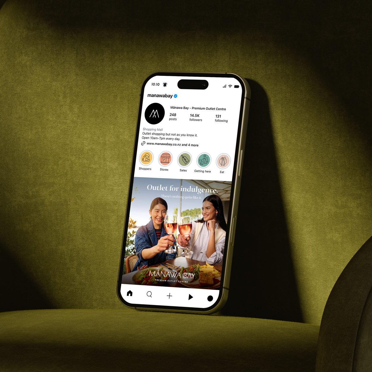 Photo of a smartphone showing the Mānawa Bay Instagram page, with an Instagram post image created by Difference