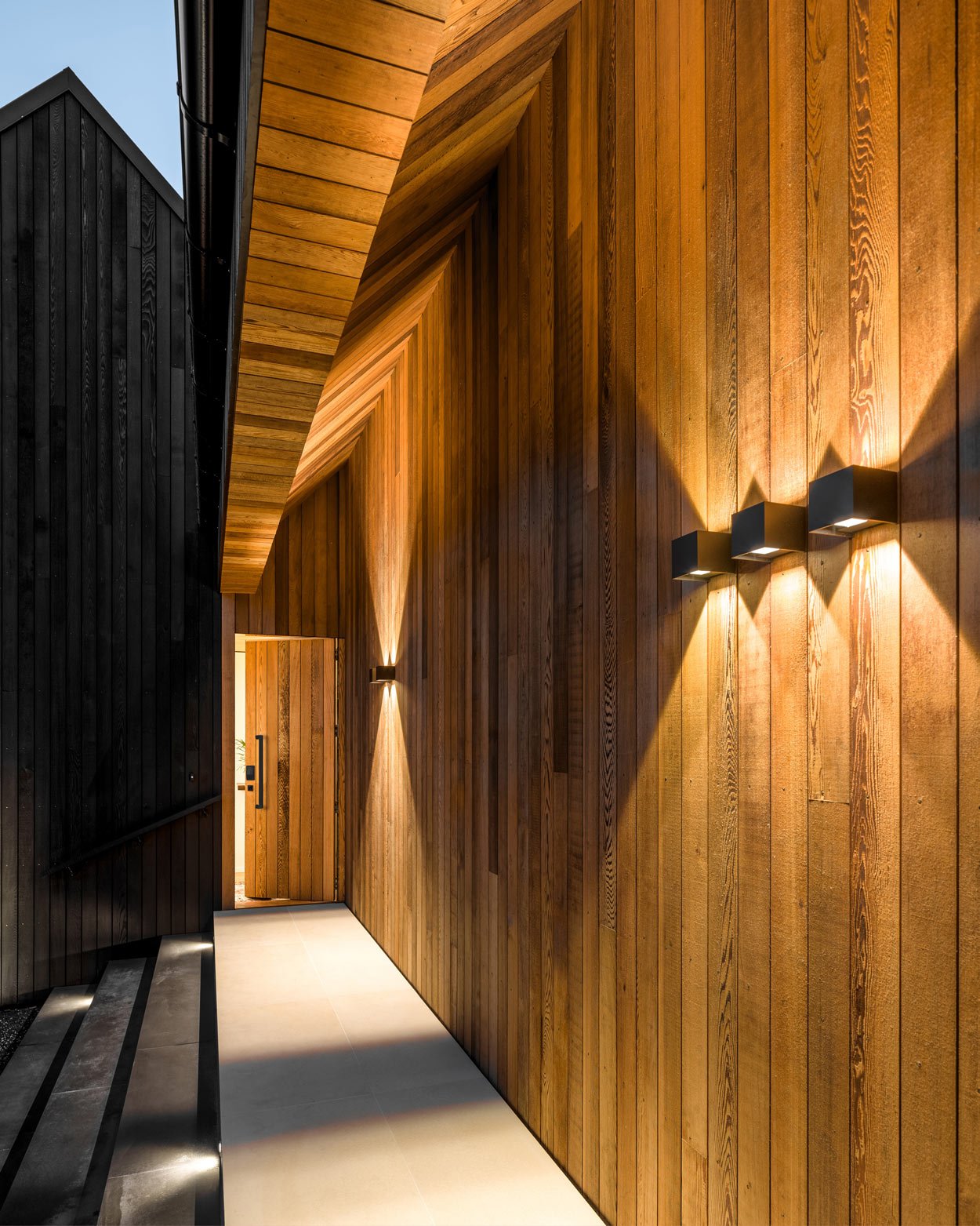 Photo of a luxury Kiwi home showing a Schlage entrance handle on the front door